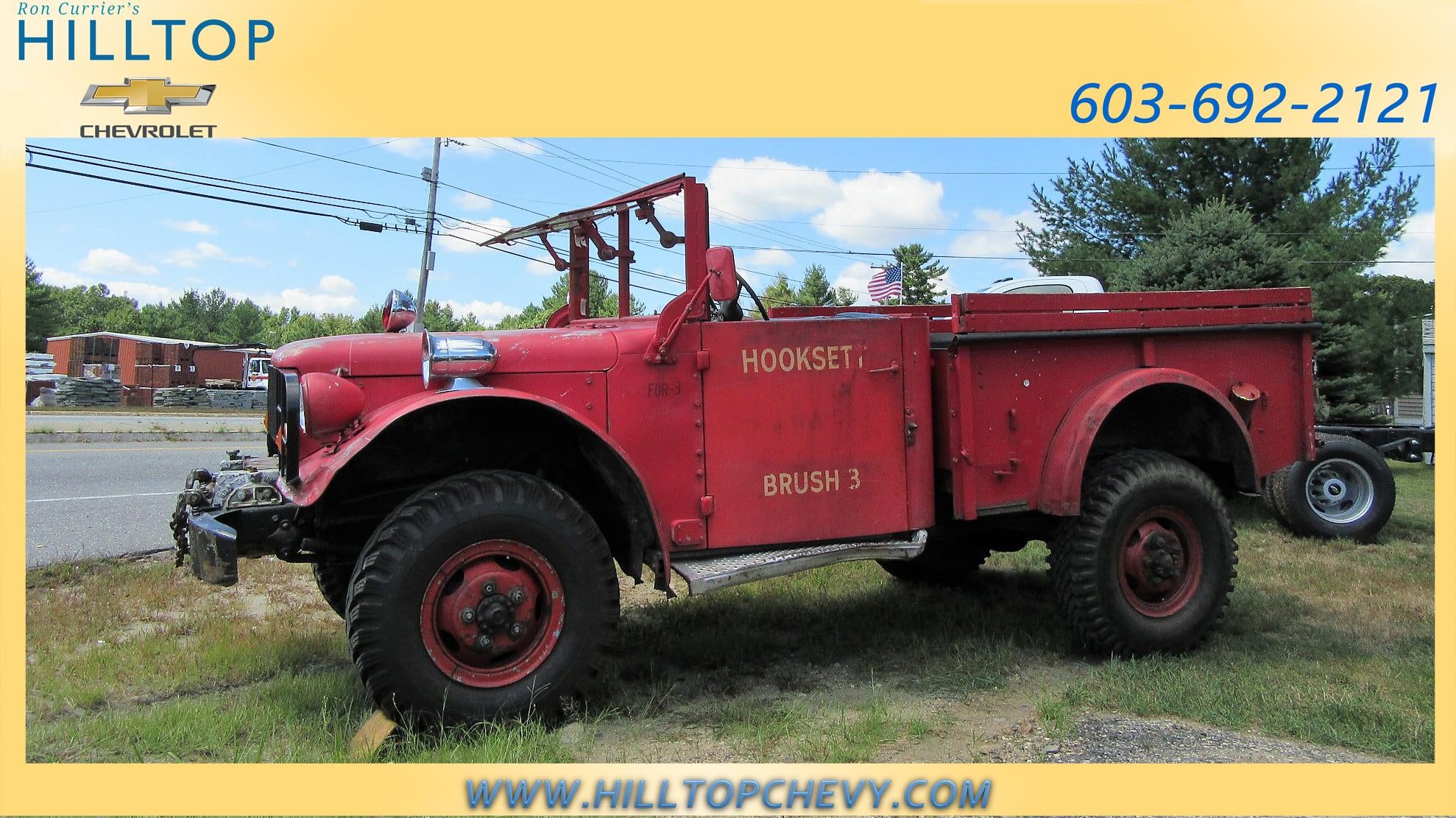 Red fire truck with HOOKSET BRUSH 3 on its side.